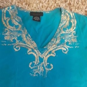 Aqua top with gold trimming around the neck.